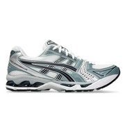 An Asics Gel-Kayano 14 running shoe in white and gray colors with a visible sole unit and lace-up closure.